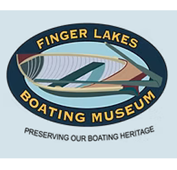 Finger Lakes Boating Museum blue oval with yellow lettering with a row boat in the middle of the oval
